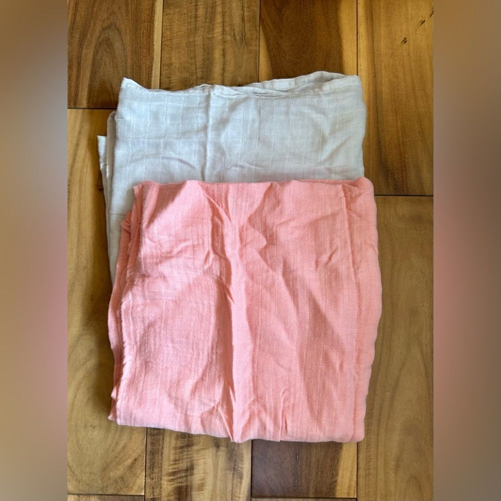 Peach and cream baby swaddles. Set of 2